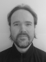 Greyscale head and shoulders of Ben Young