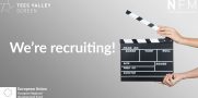 black clapperboard on grey background with white text